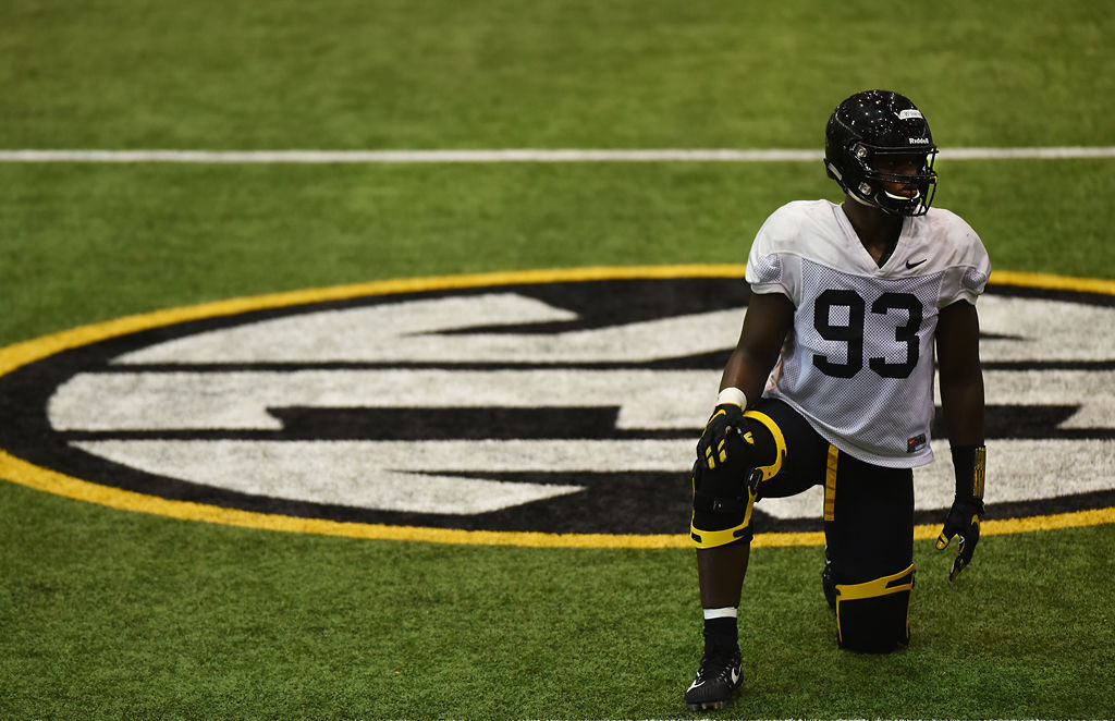 Redshirt sophomore defensive lineman Tre Williams takes a knee